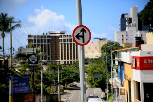 salvador, bahia, brazil - july 20, 2021: traffic sign indicating to go ahead or turn left into a street in the city of Salvador.