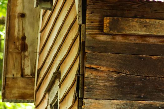 Wood grain texture corner of brown wooden cabin . High quality photo