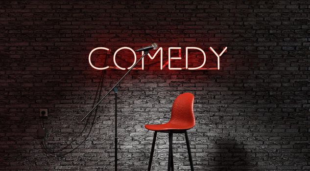 Stand-up comedy stage illuminated by a spotlight with the word COMEDY in red neon lamp. 3d render