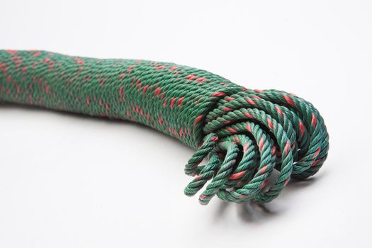 Green nylon rope on a white ground