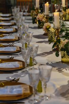 White green and golden decorations on wedding table at outdoor wedding