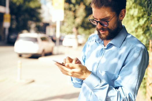 business man with phone outdoors communication lifestyle. High quality photo
