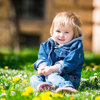 Smiling baby in field of flowers
