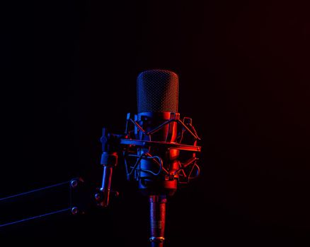 Professional microphone in pink smoke on a black background