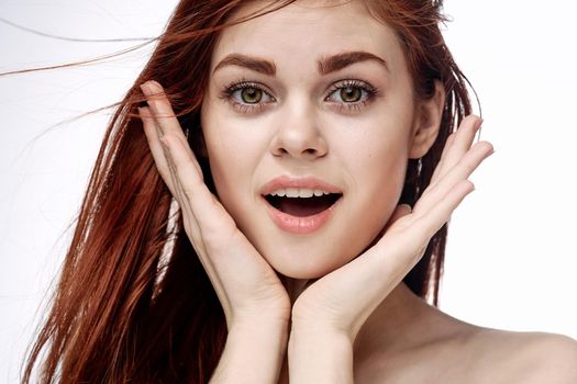 red-haired woman attractive look naked shoulders cosmetics smile. High quality photo
