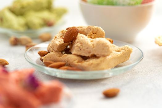 Close up photo of colorful Turkish halva sweets on gray surface