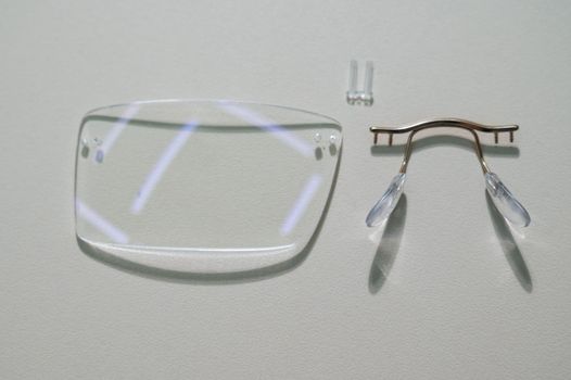 Disassembled glasses and instruments by an ophthalmologist