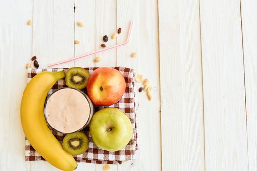 fresh fruit cocktail breakfast dessert organic wood background. High quality photo