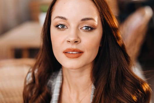 portrait of an Attractive young woman who is sitting in a cafe. Cafe urban lifestyle. Random portrait.