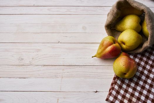 pears on wooden table agriculture vitamins close-up. High quality photo