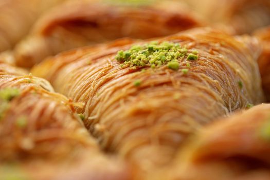 Close up photo of Turkish Baklava dessert with honey and nuts