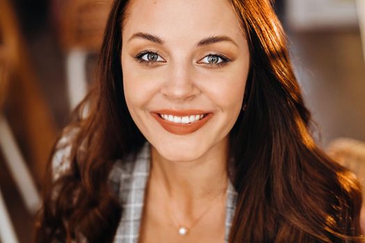 portrait of an Attractive young woman who is sitting in a cafe. Cafe urban lifestyle. Random portrait.