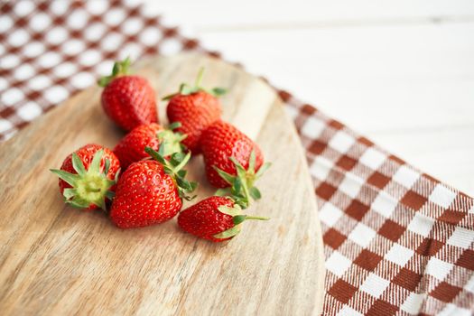 fresh strawberries on wooden board fruit vitamins summer. High quality photo