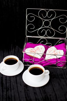 Valentine's Day: two cups of coffee and biscuits in the form of heart. valentine card