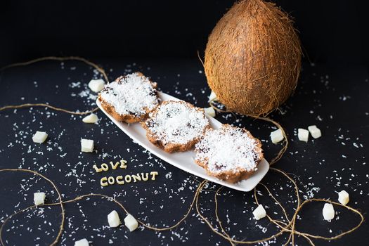 coconut muffins on a black background with words like candied fruits and coconuts