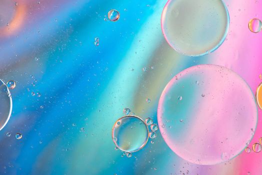 Oil drops in water. Defocused abstract psychedelic pattern image pastel colored. Abstract background with colorful gradient colors. DOF