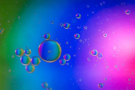Oil drops in water. Abstract psychedelic pattern image multicolored. Abstract background with colorful gradient colors.