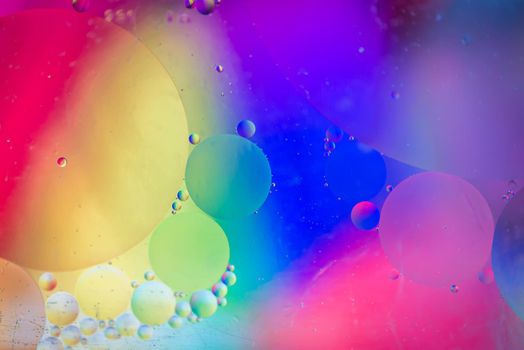 Oil drops in water. Abstract psychedelic pattern image rainbow colored. Abstract background with colorful gradient colors.