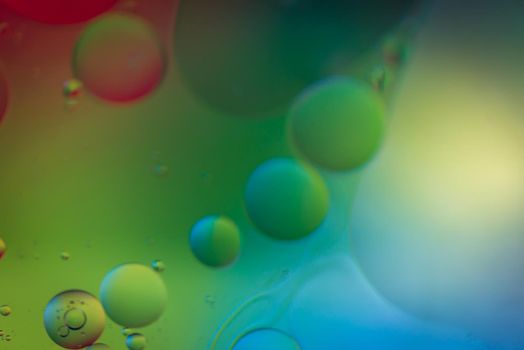 Oil drops in water. Abstract defocused psychedelic pattern image rainbow colored. Abstract background with colorful gradient colors.