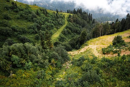 Scenic green mountains and beautiful sky clouds for a background