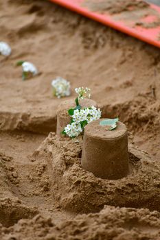 Empty Children's sandbox with a crafts and flowers, Russia