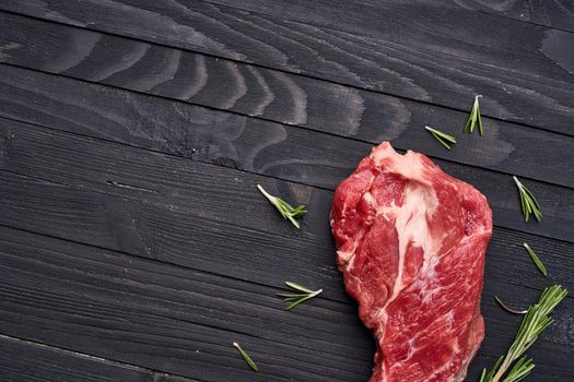 meat beef rosemary steak ingredients wooden table. High quality photo