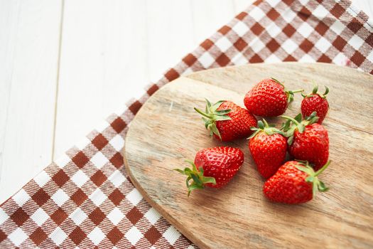 fresh strawberries on wooden board fruit vitamins summer. High quality photo