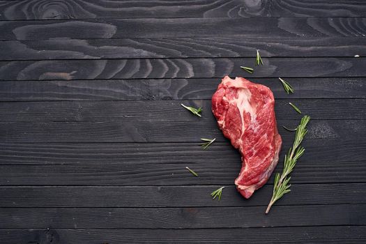 meat beef rosemary steak ingredients wooden table. High quality photo