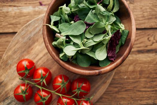 a plate of lettuce cherry tomatoes cooking ingredients organic healthy food. High quality photo