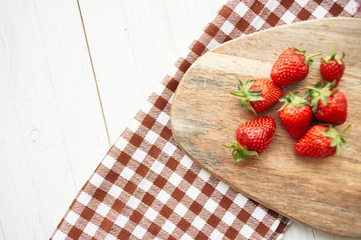 fresh strawberries on wooden board fruit vitamins summer. High quality photo