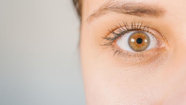 Macro image of human eye with contact lens. Woman's eye close-up.