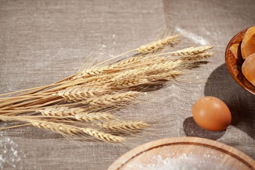 wheat ears on a burlap, healthy food, homemade pastries