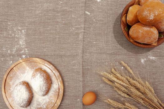 banner with homemade pastries on a bag, pies and buns, wheat ears, copy space