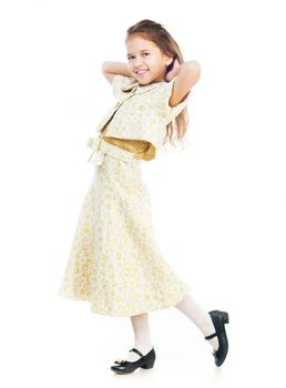 Cute little girl in a light dress isolated on white background