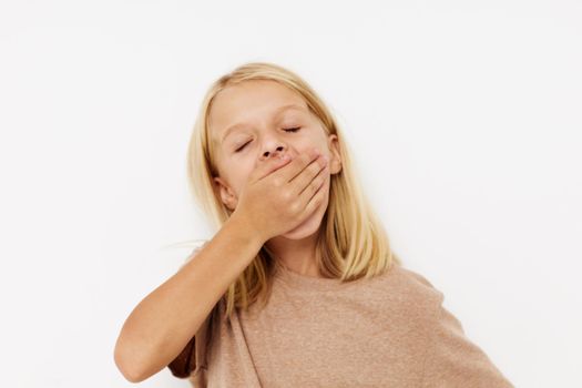 Little cute girl with blond hair lifestyle concept. High quality photo
