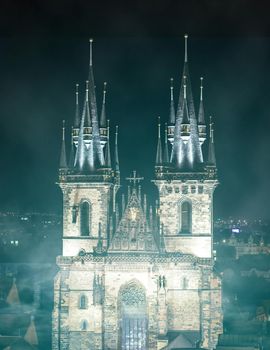 Church of Our Lady before Tyn in evening in Prague, Czech Republic. Church with towers height of 80 meters