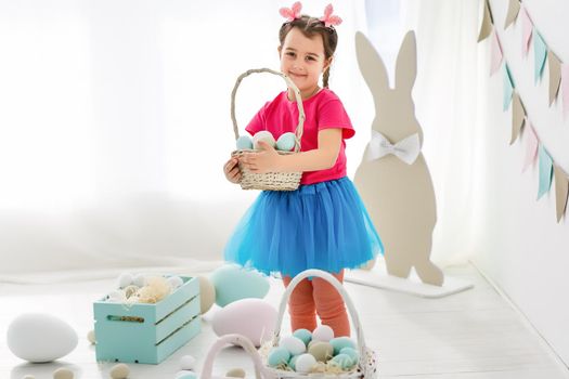 bunny ears and basket of Easter eggs