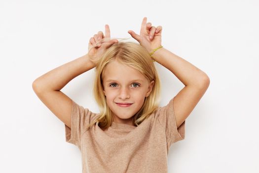 Beautiful little girl with blond hair lifestyle concept. High quality photo
