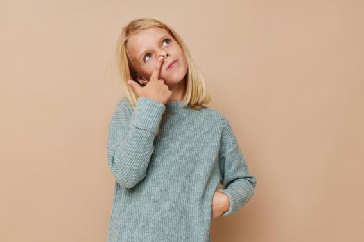 Beautiful little girl with blond hair kids lifestyle concept. High quality photo