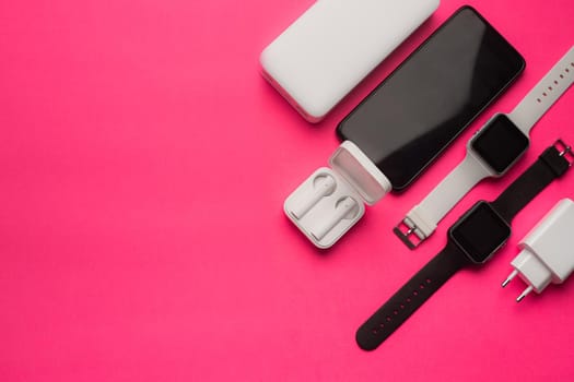 Layout of modern gadgets on a pink background . Online communication. Internet connection. Mobile communication. 5g. Black and white technology. Modern technologies. Copy space