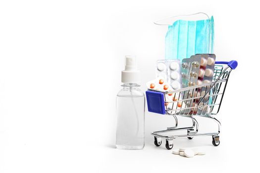 Shopping cart with pills on a white background . Medicines. Medicine. Purchase of medicines. The rise in price of medicines. Copy Space