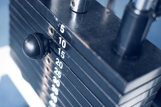 Stack of metal weights in gym bodybuilding equipment