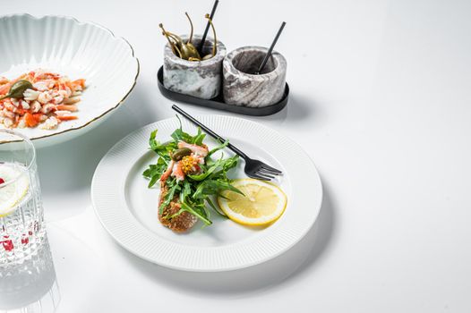 Salad with Crab meat on a kitchen table. White background. Top view. Copy space.