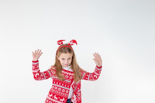 Portrait of excited funny funky schoolchild dancing in christmas costume