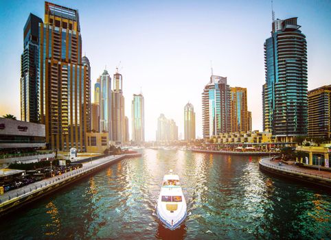 DUBAI, UAE - DECEMBER 14: Modern buildings in Dubai Marina, on december 14, 2013, Dubai, UAE. In the city of artificial channel length of 3 kilometers along the Persian Gulf.