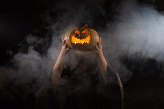 Pumpkin jack o lantern instead of a woman's head. Halloween.