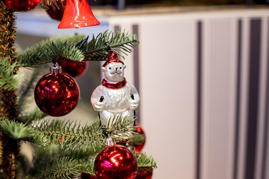 Christmas tree with blue and white toys in the interior.Christmas card