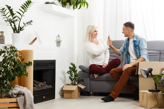 Happy young couple moving in new house