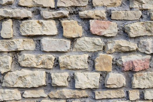 Background of stone wall texture.Ancient wall built of white stone