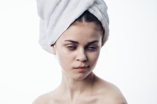 woman after shower with towel on head posing skin care. High quality photo